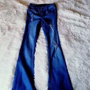 High waisted flared ripped jeans